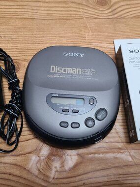 Sony Discman with new earphones and power adapter